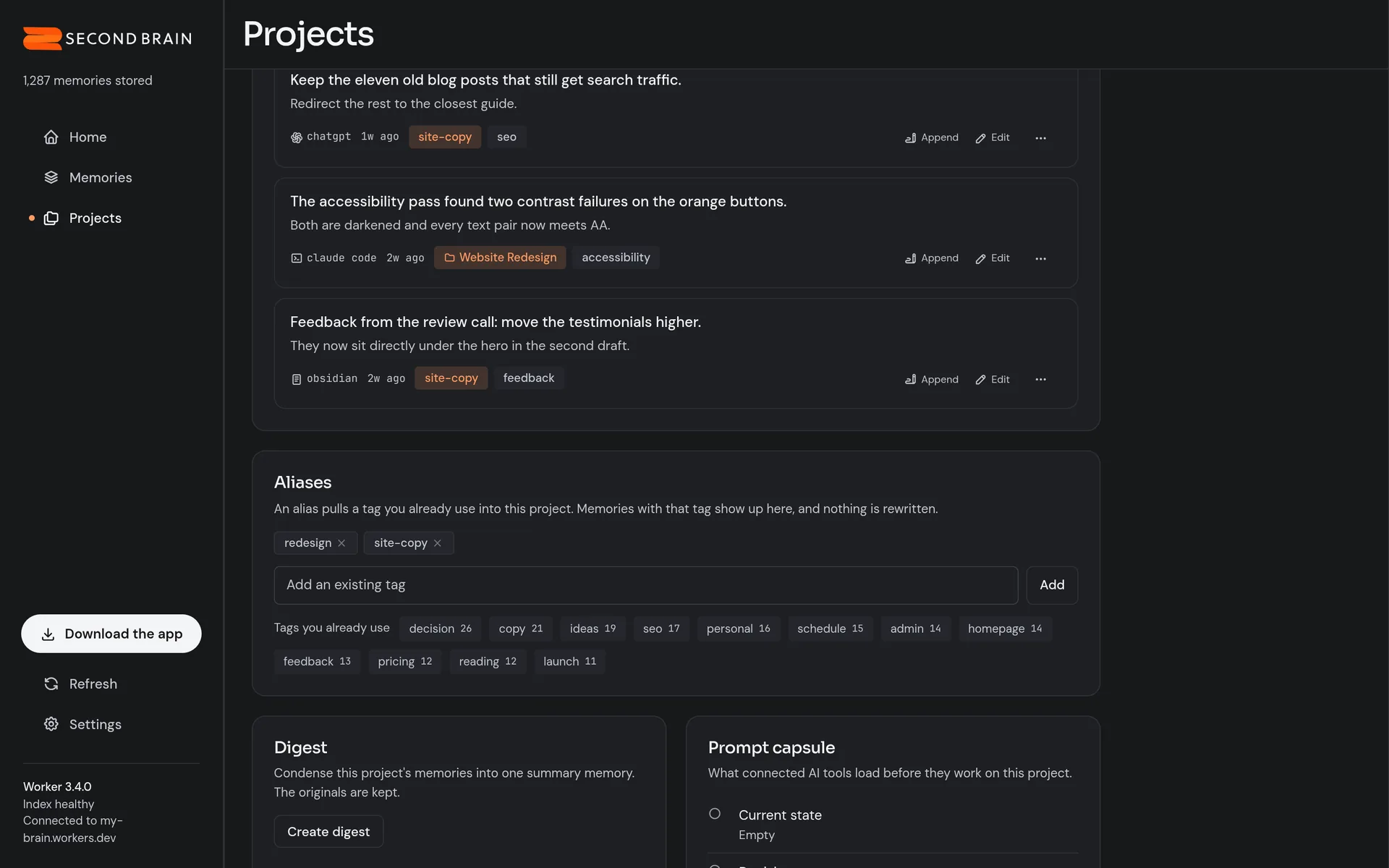 One project’s page in the dashboard, in dark mode. Its memories are listed, including notes that joined through the alias site-copy, above an Aliases panel showing redesign and site-copy with existing tags suggested for adding.
